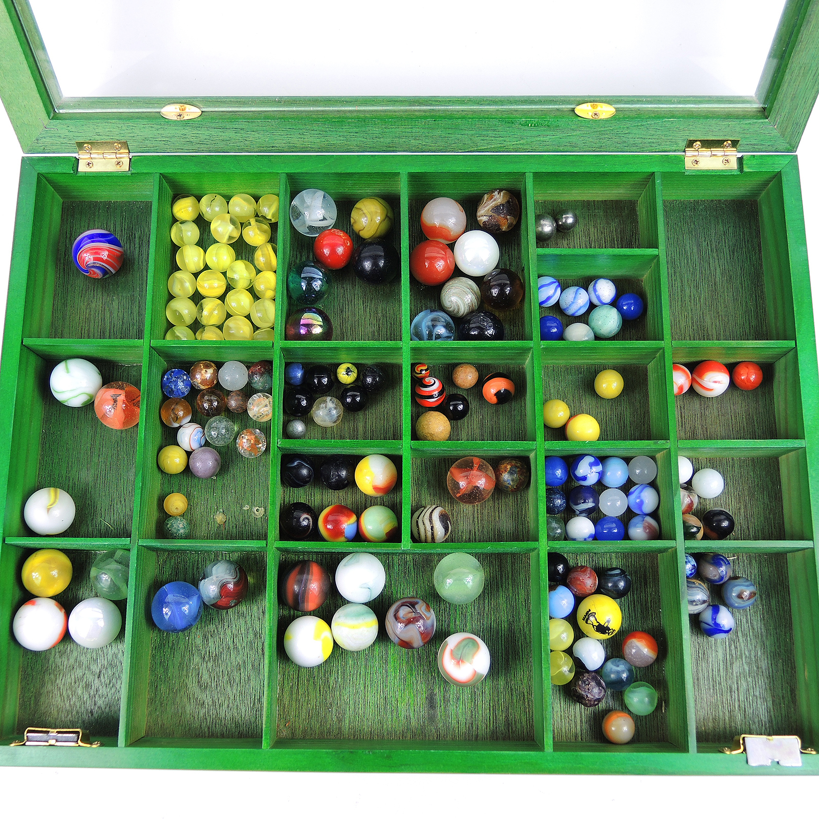 Glass and Clay Marbles with Corkscrews and Large Peppermint in Display