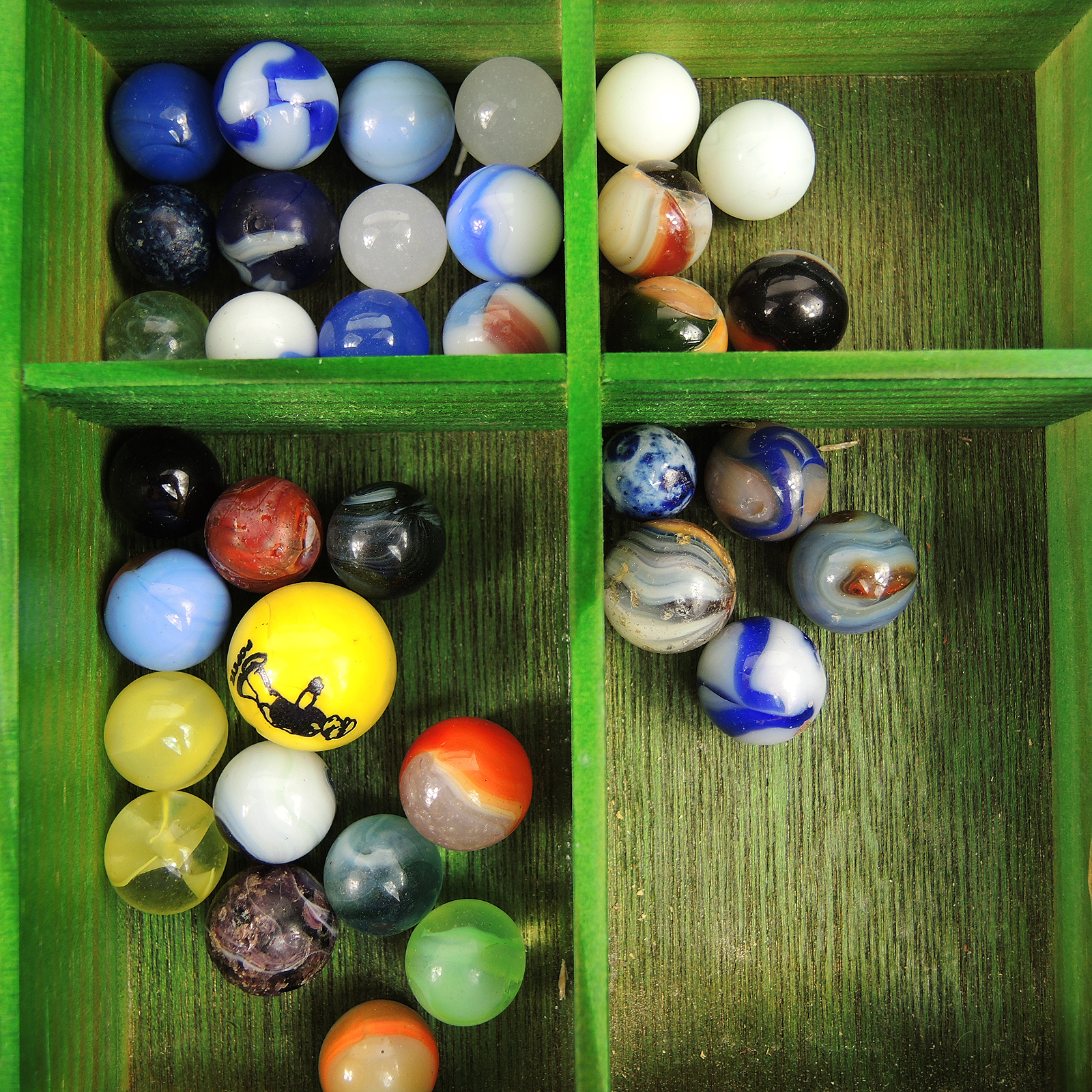 Glass and Clay Marbles with Corkscrews and Large Peppermint in Display