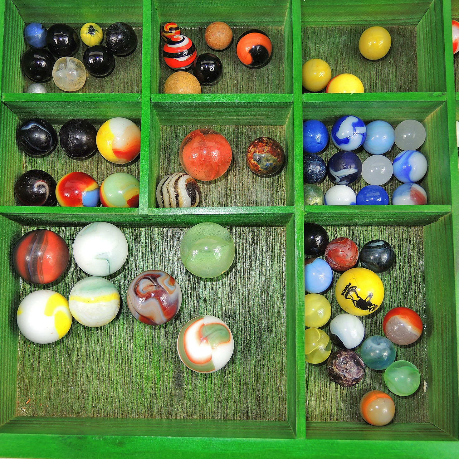 Glass and Clay Marbles with Corkscrews and Large Peppermint in Display