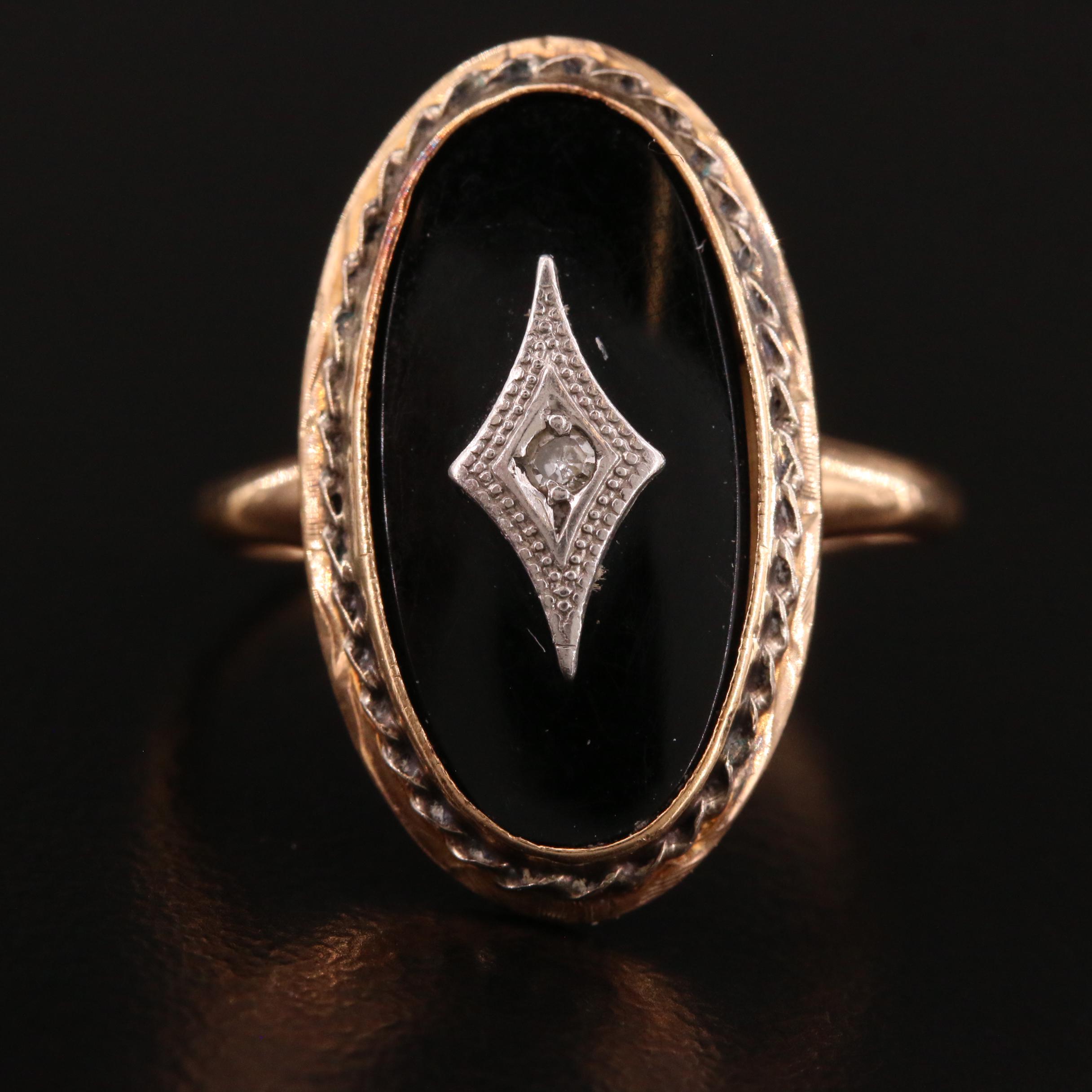 black onyx ring with diamond in center