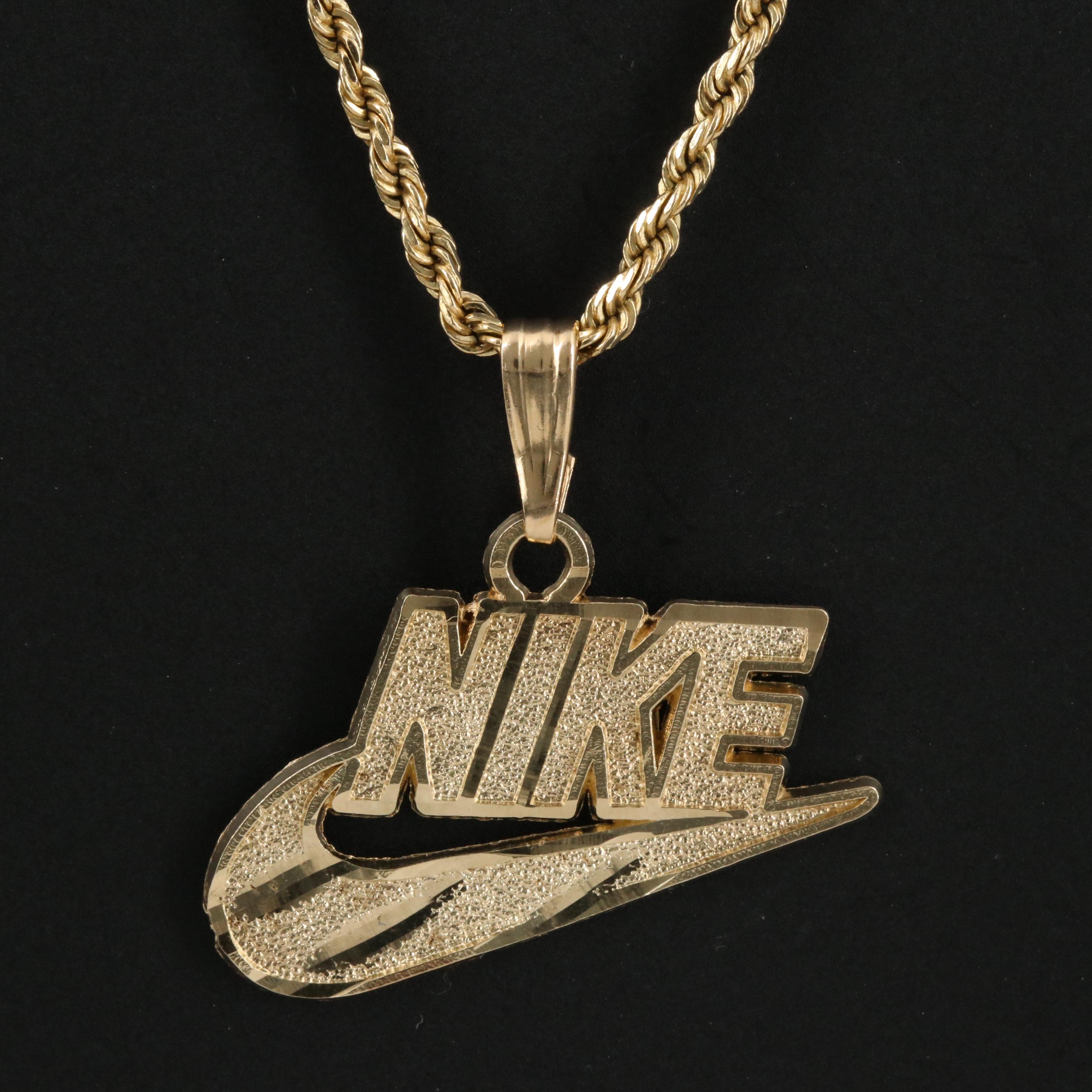 10k gold nike pendant