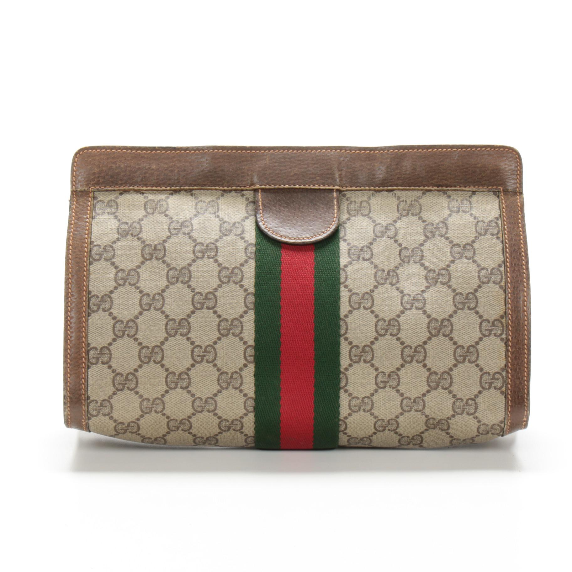 gucci supreme clutch