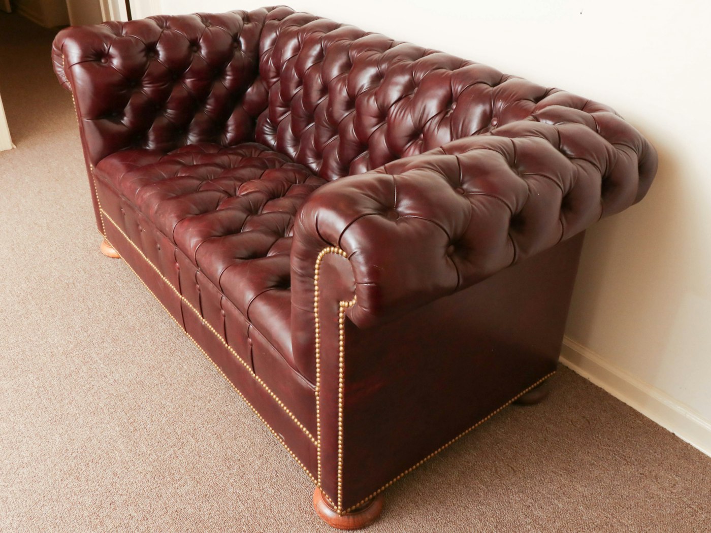 tufted leather sofa and loveseat