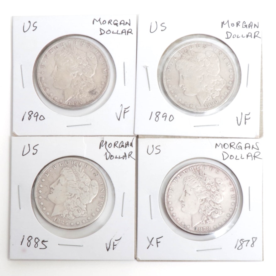 1878, 1885, and two 1890 Morgan Silver Dollars