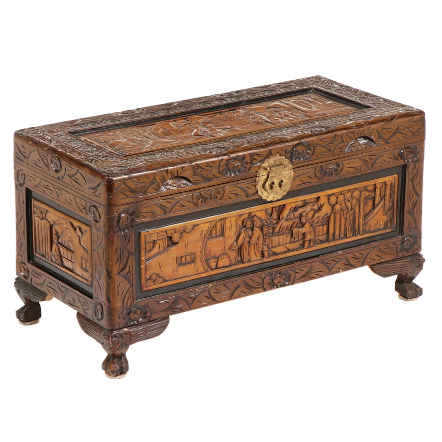 Chinese Relief-Carved and Parcel-Ebonized Lift-Lid Chest