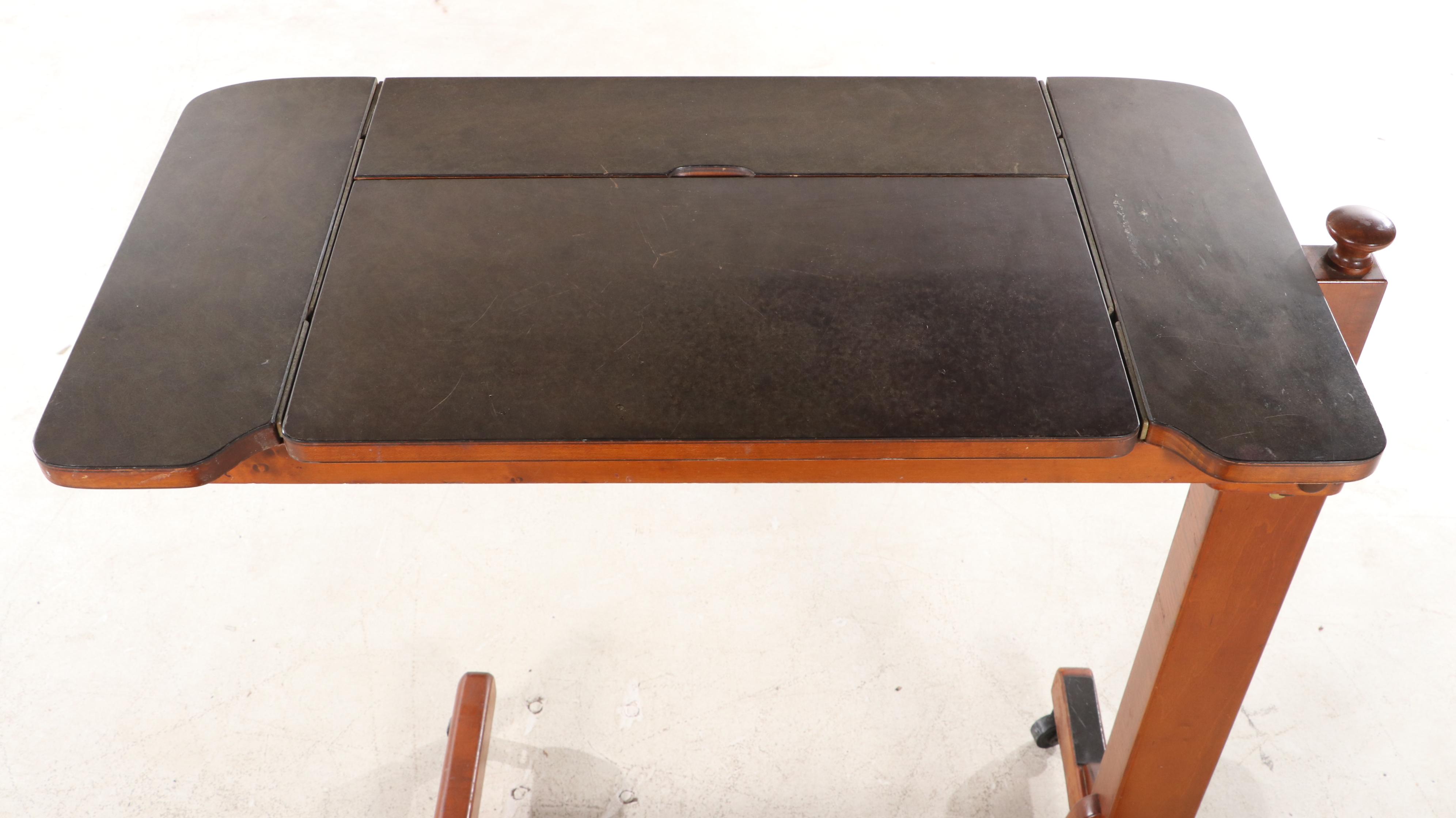 The HillRom Company Maple and Laminate Top Adjustable Overbed Table