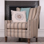 Fairfield Upholstered Armchair with Decorative Pillow and Woven Cotton Throw