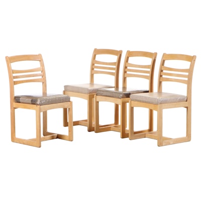 Four Blond Finished Dining Chairs on Runner Base