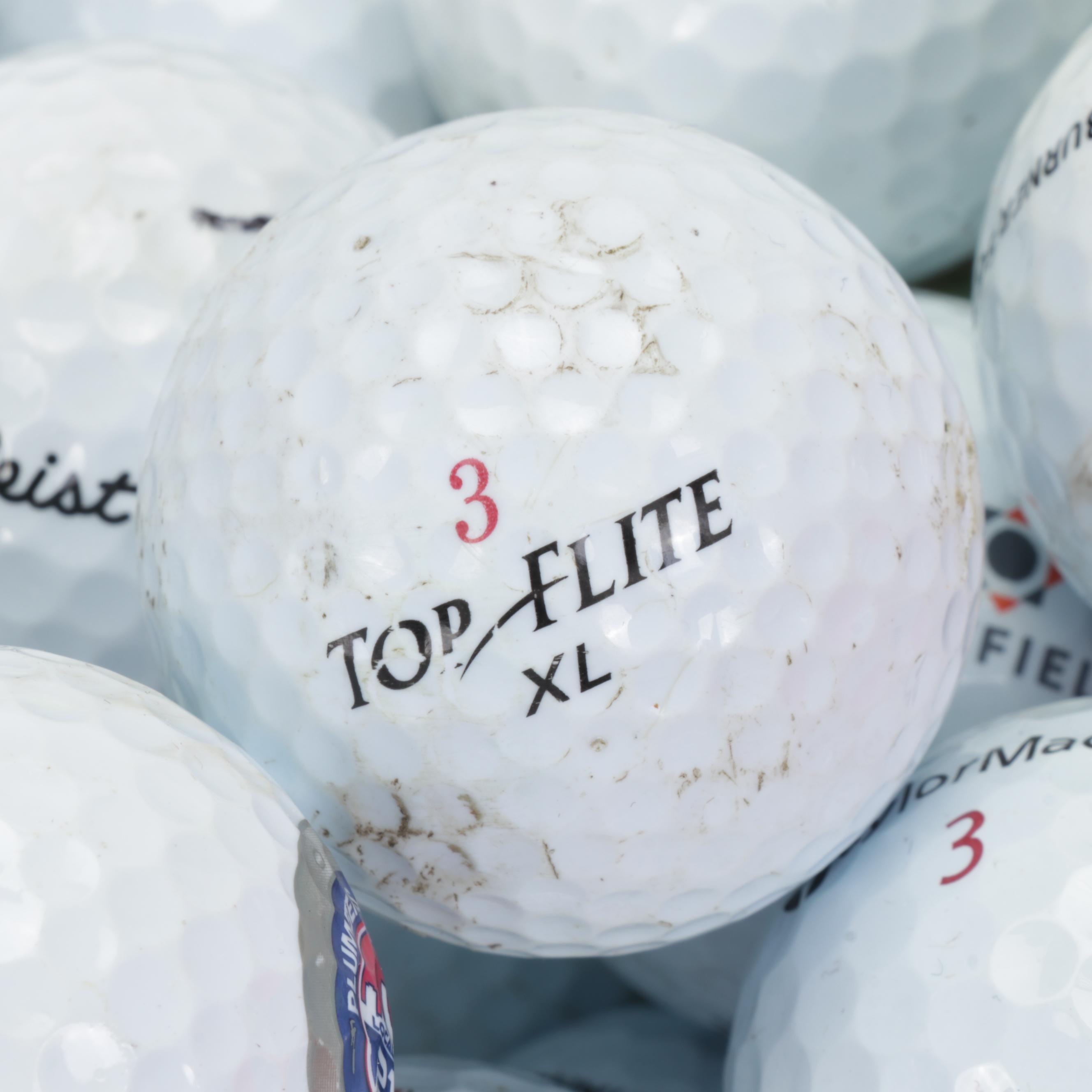 200 Titleist, TaylorMade, and Top Flight Golf Balls EBTH