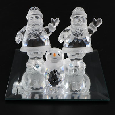 Swarovski Crystal Santas and Snowman with Display Mirror