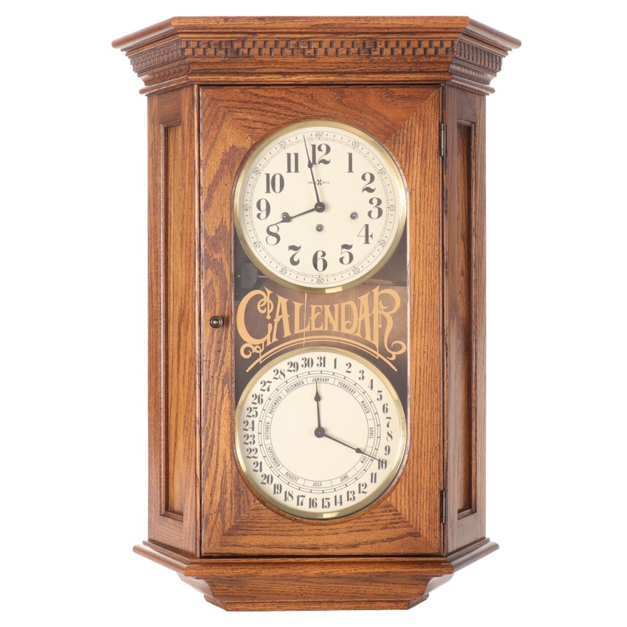 Howard Miller Oak Case Calendar Wall Clock with Westminster Chime