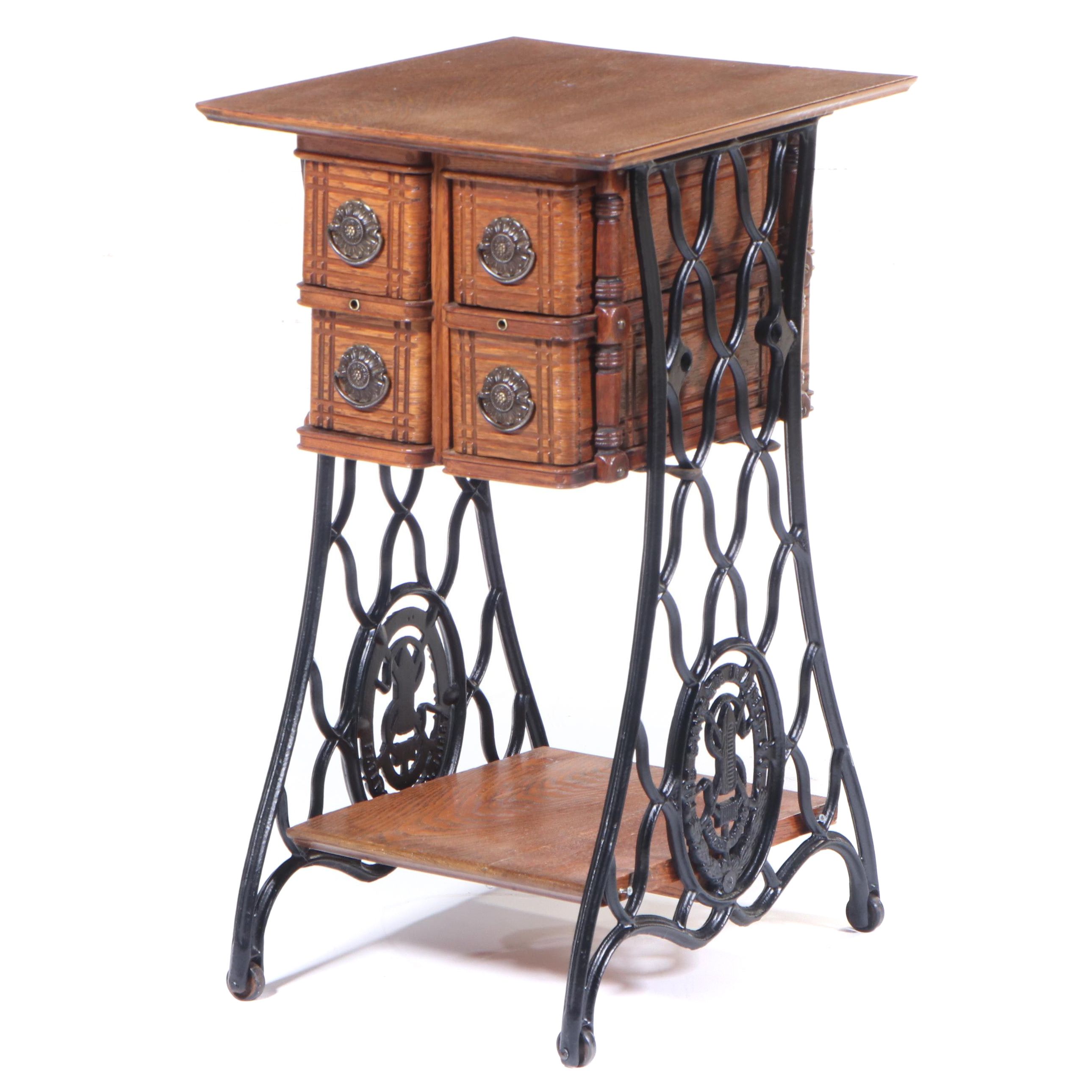 The Singer Mfg. Co. Oak and Cast Iron FourDrawer Side Table, Adapted