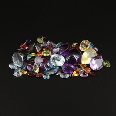 Loose 63.09 CTW Gemstones Including Swiss Blue Topaz and Amethyst
