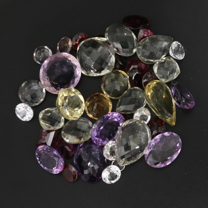 Loose 137.63 CTW Mixed Lot Including Citrine, Amethyst and Garnet