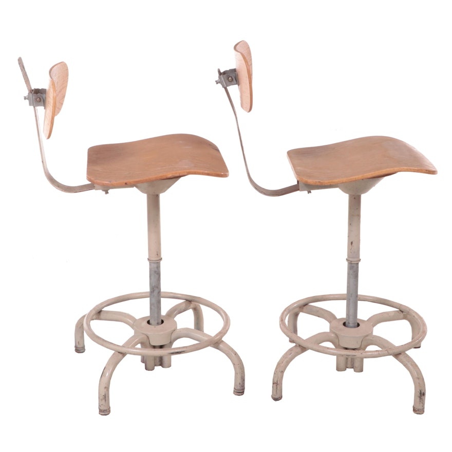 Pair of Ajusto Equipment Co. Painted Steel and Faux Wood Swivel Drafting Stools