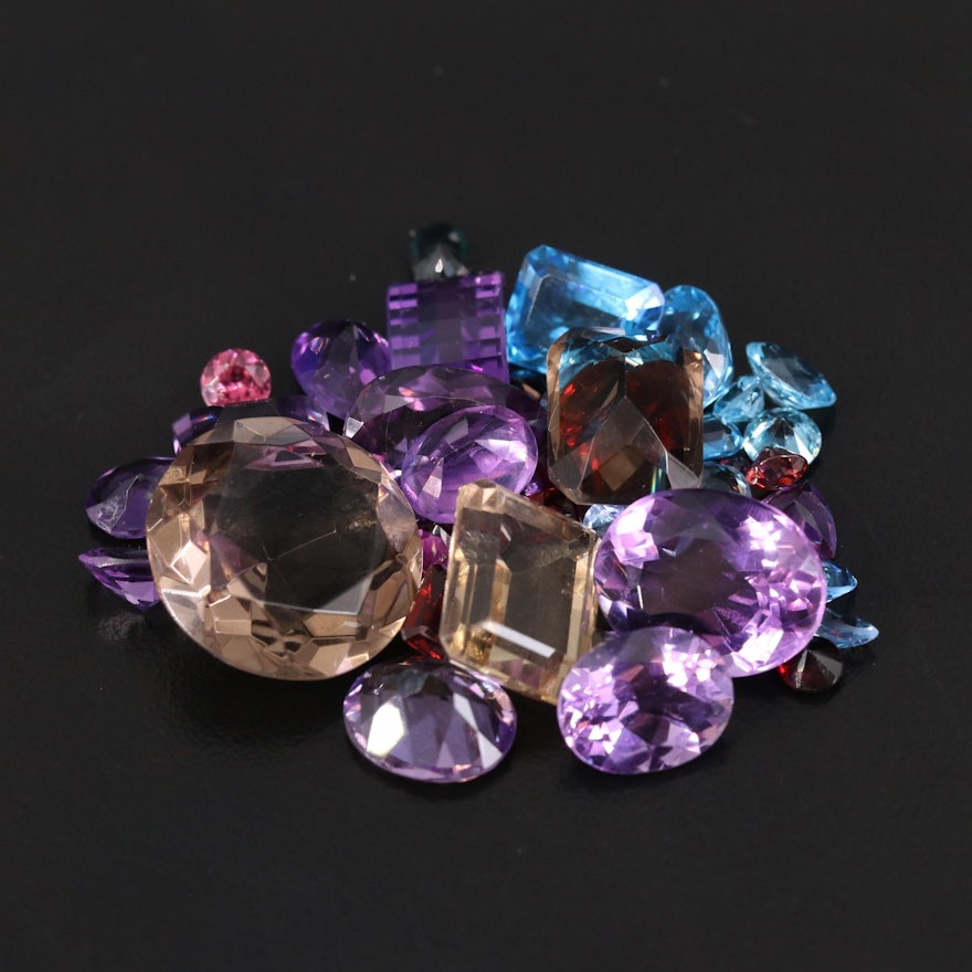 Loose 83.45 CTW Gemstones Including Amethyst, Garnet and Smoky Quartz