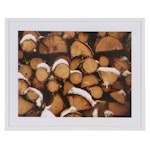 Offset Lithograph of Stacked Logs with Snow