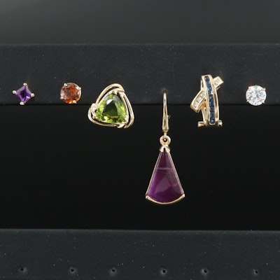 Assortment of Single 14K Earrings Including Diamond, Sapphire and Zircon