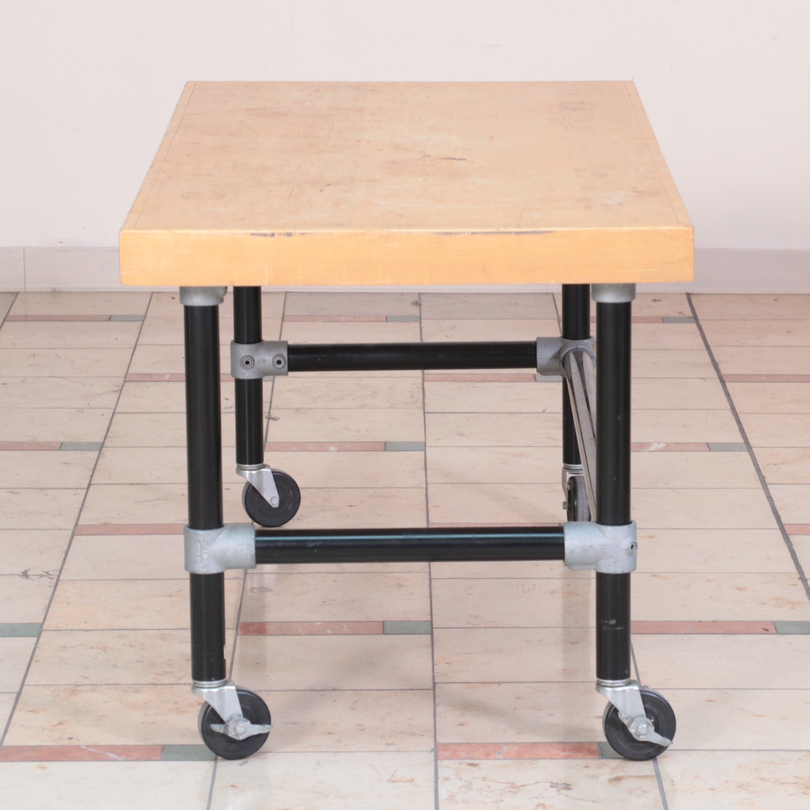 Three Metal and WoodVeneered Top Rolling Retail Display Tables EBTH
