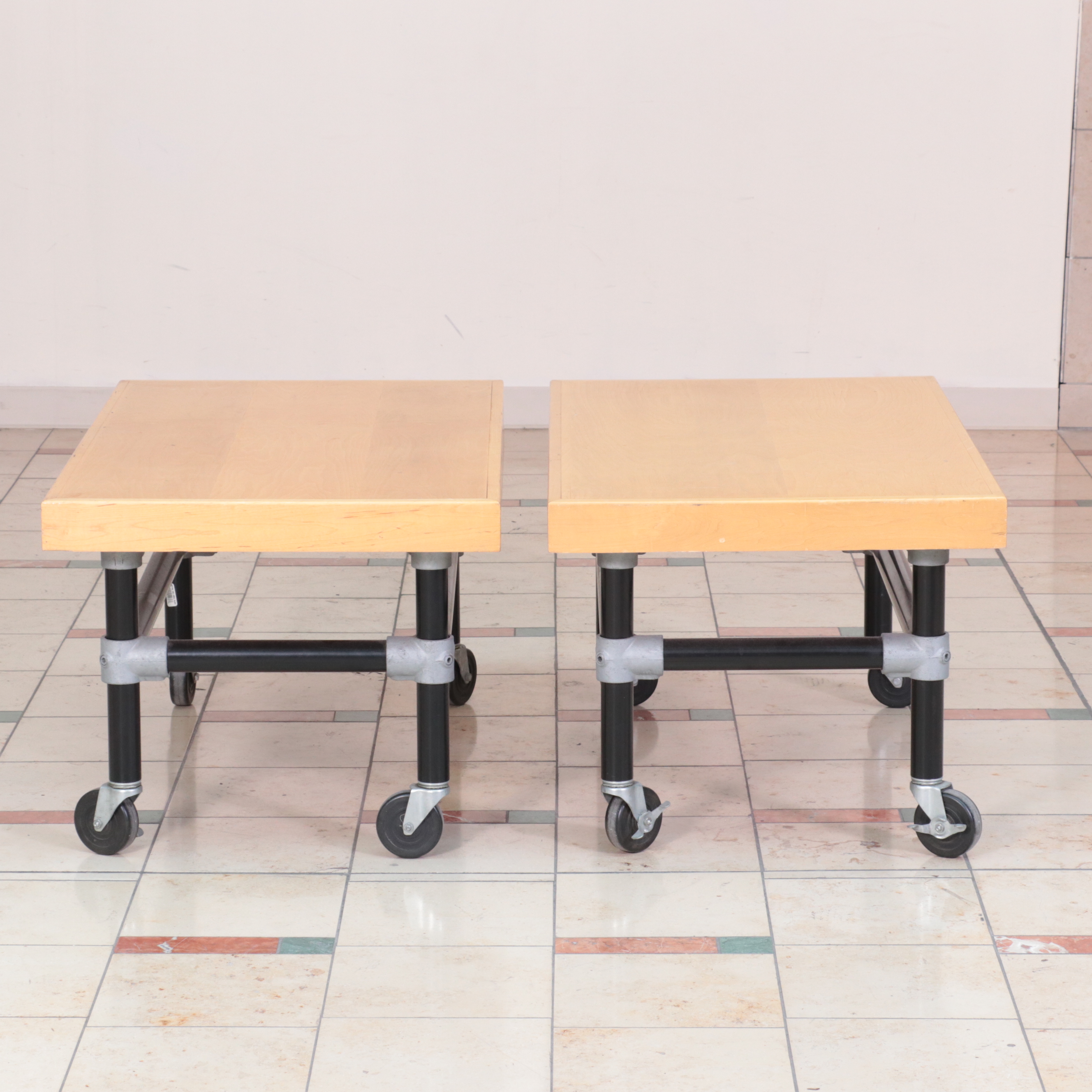 Three Metal and WoodVeneered Top Rolling Retail Display Tables EBTH