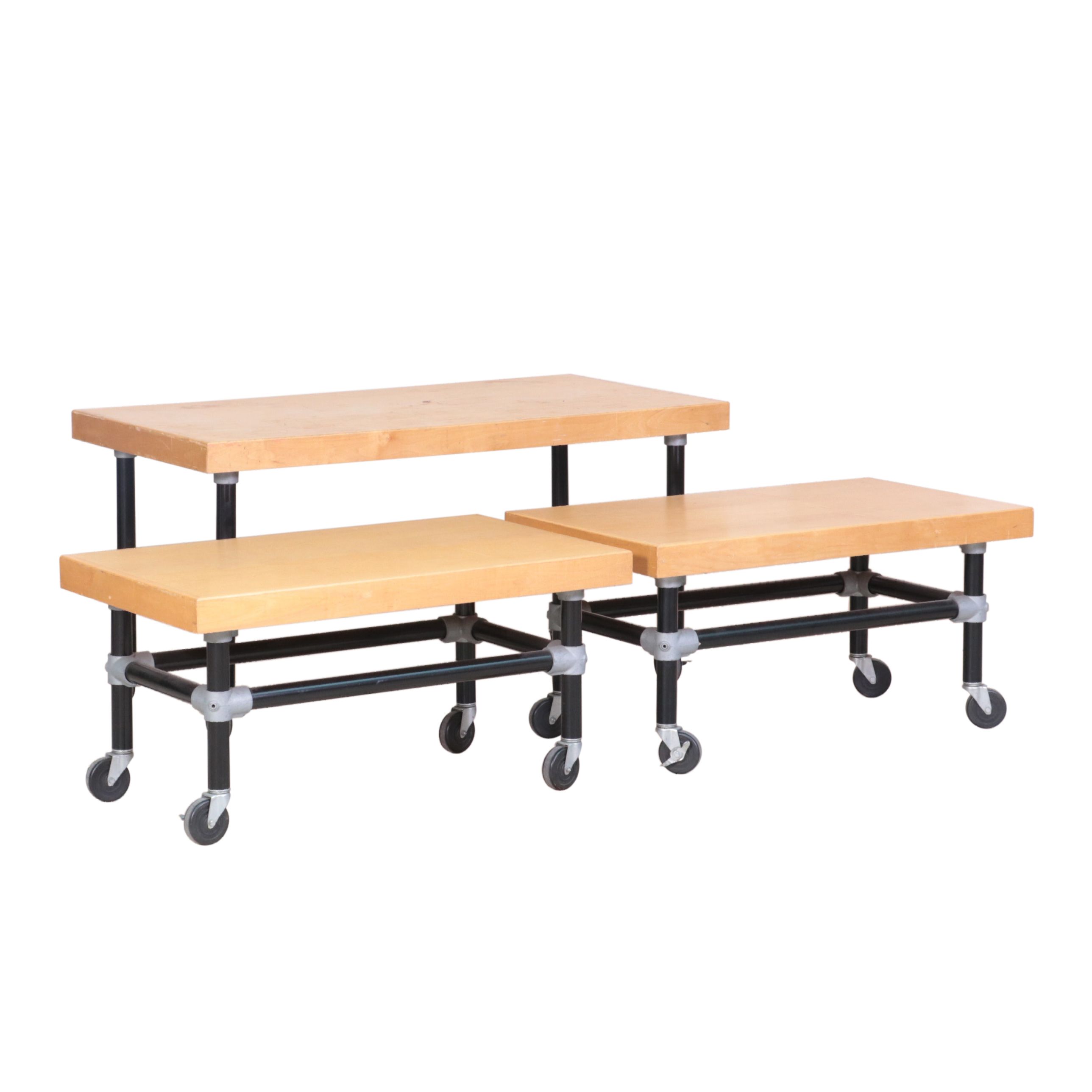 Three Metal and WoodVeneered Top Rolling Retail Display Tables EBTH
