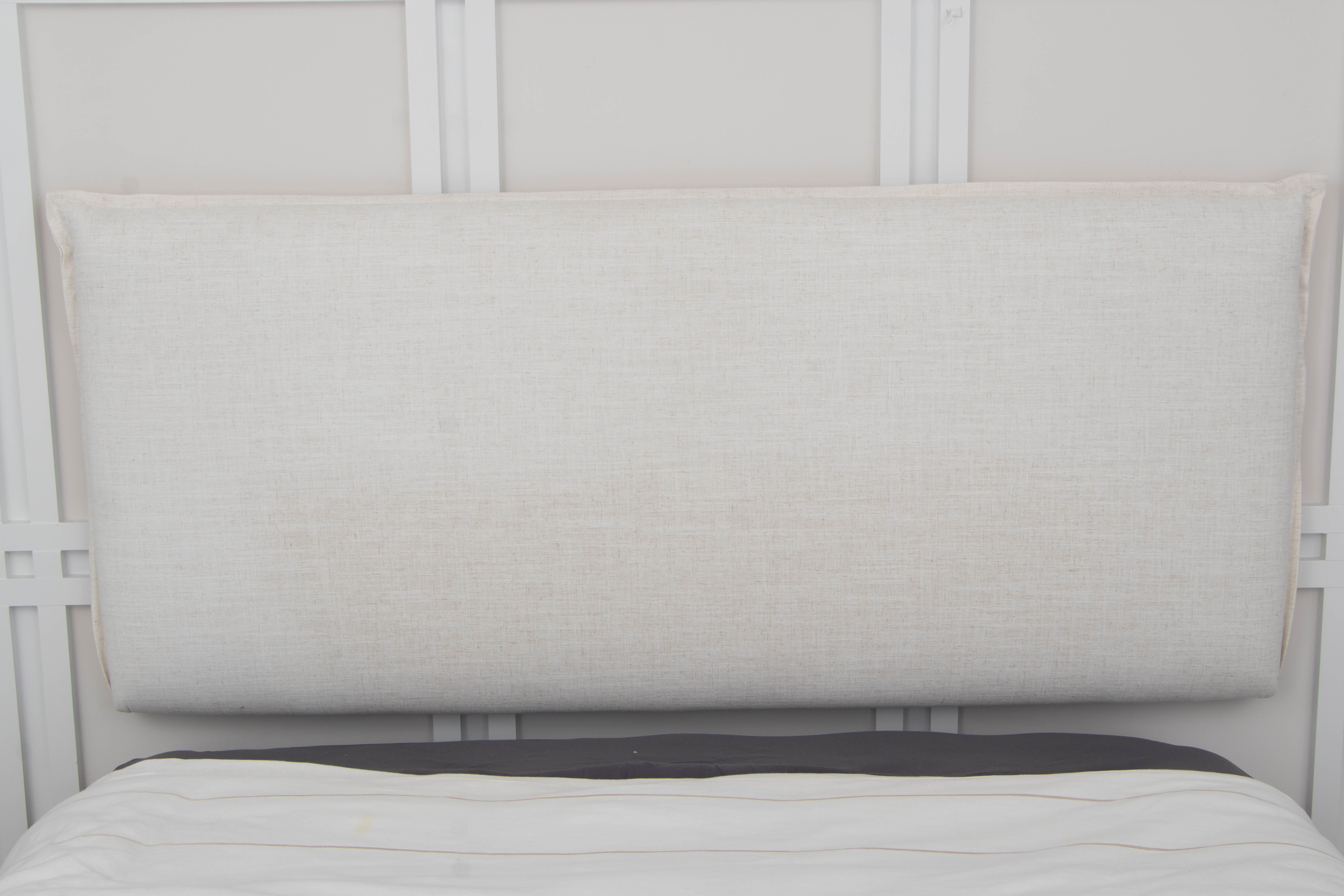 Upholstered Wall Mounted Headboard with Queen Sized Mattress on Frame
