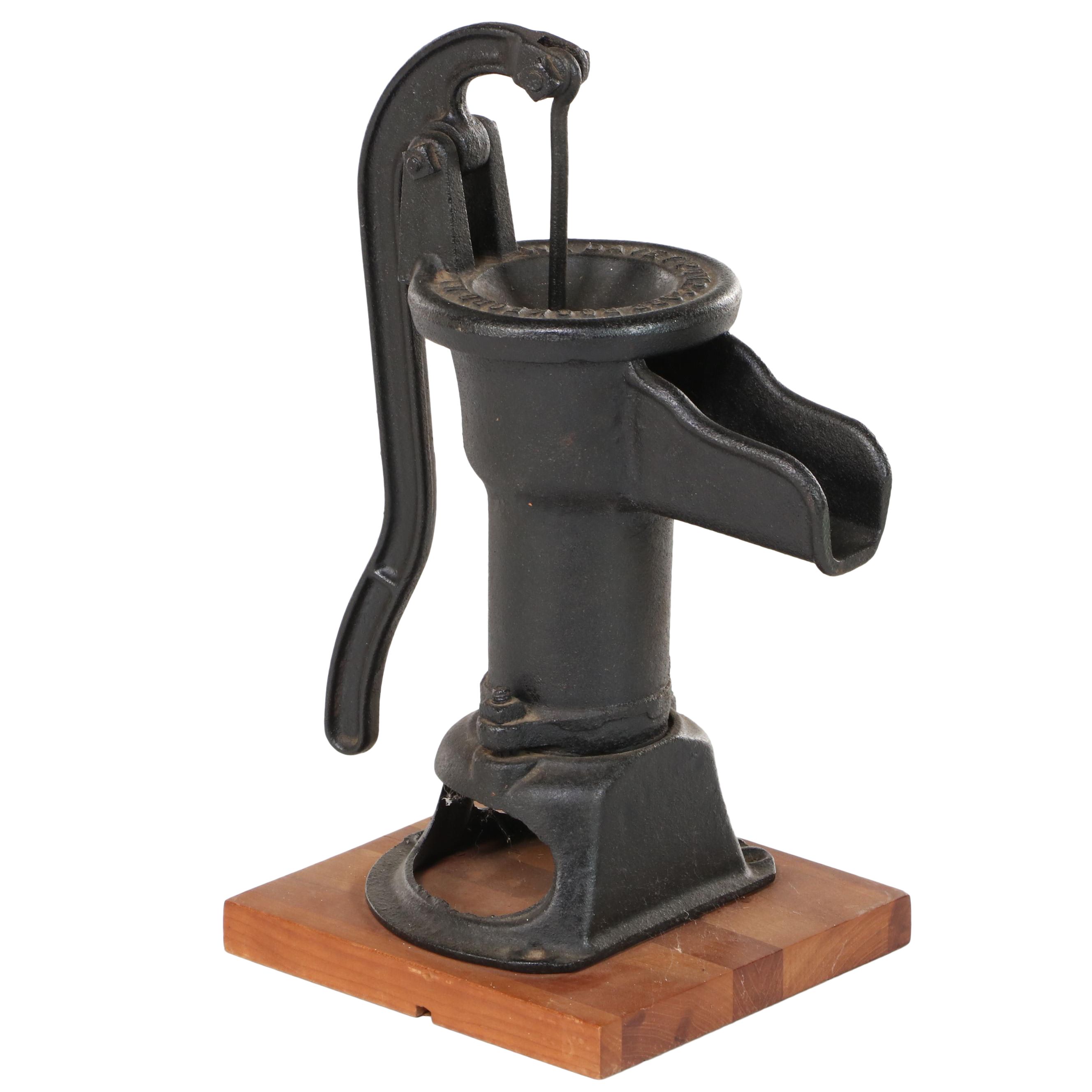 W.L. Davey Pump Corp. Cast Iron Water Hand Pump on Later Cherrywood