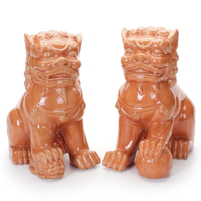 Pair of Orange Glazed Porcelain Guardian Lion Figures