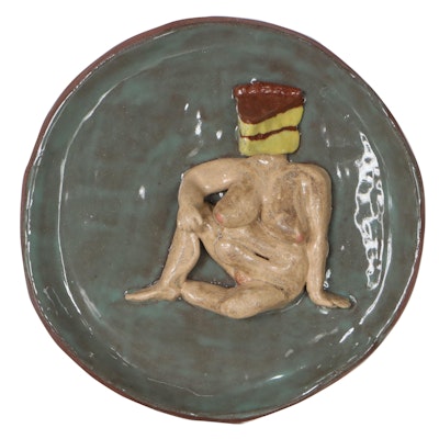 Folk Art Pottery Wall Hanging of a Seated Nude With a Cake Head