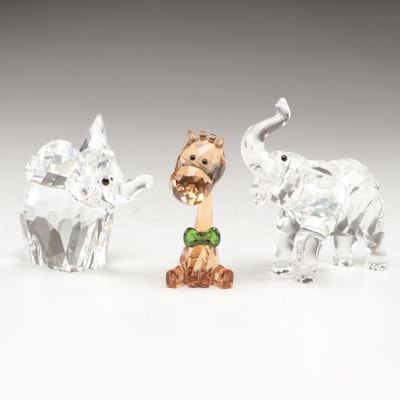Swarovski "Baby Elephant with Trunk Up," "Elephant," and SCS "Giraffe" Figurines