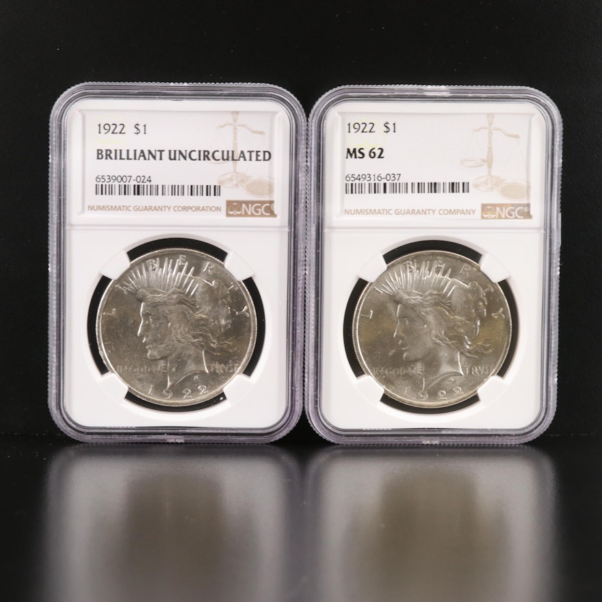 Two NGC Graded 1922 Peace Silver Dollars