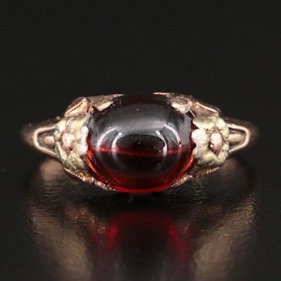 1930s 10K Garnet Ring with Green and Rose Gold Flower Accents
