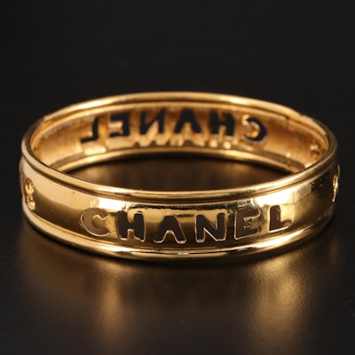 Chanel Cut-Out Logo Bangle Bracelet in Gold-Tone Metal