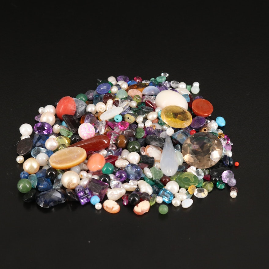 Loose Gemstones Including Smoky Quartz, Coral, and Pearl