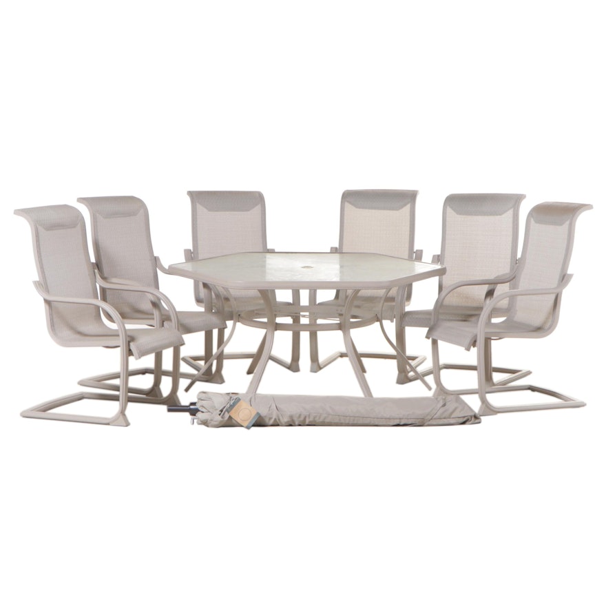 Hexagonal Patio Dining Set with Leaf-Patterned Glass Top and Umbrella