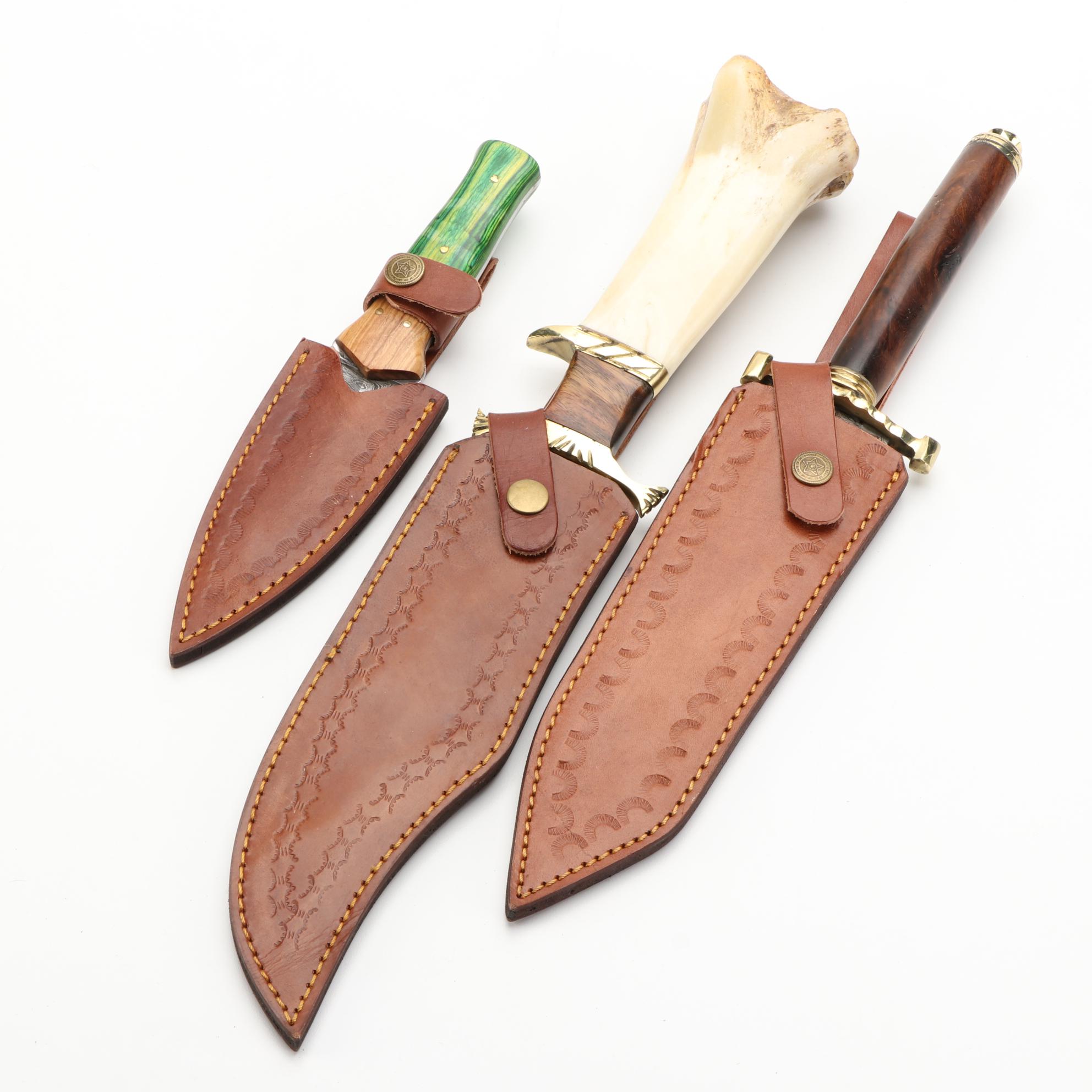 Three Different Damascus Steel, Wood, and Bone Handled Kris Knives and