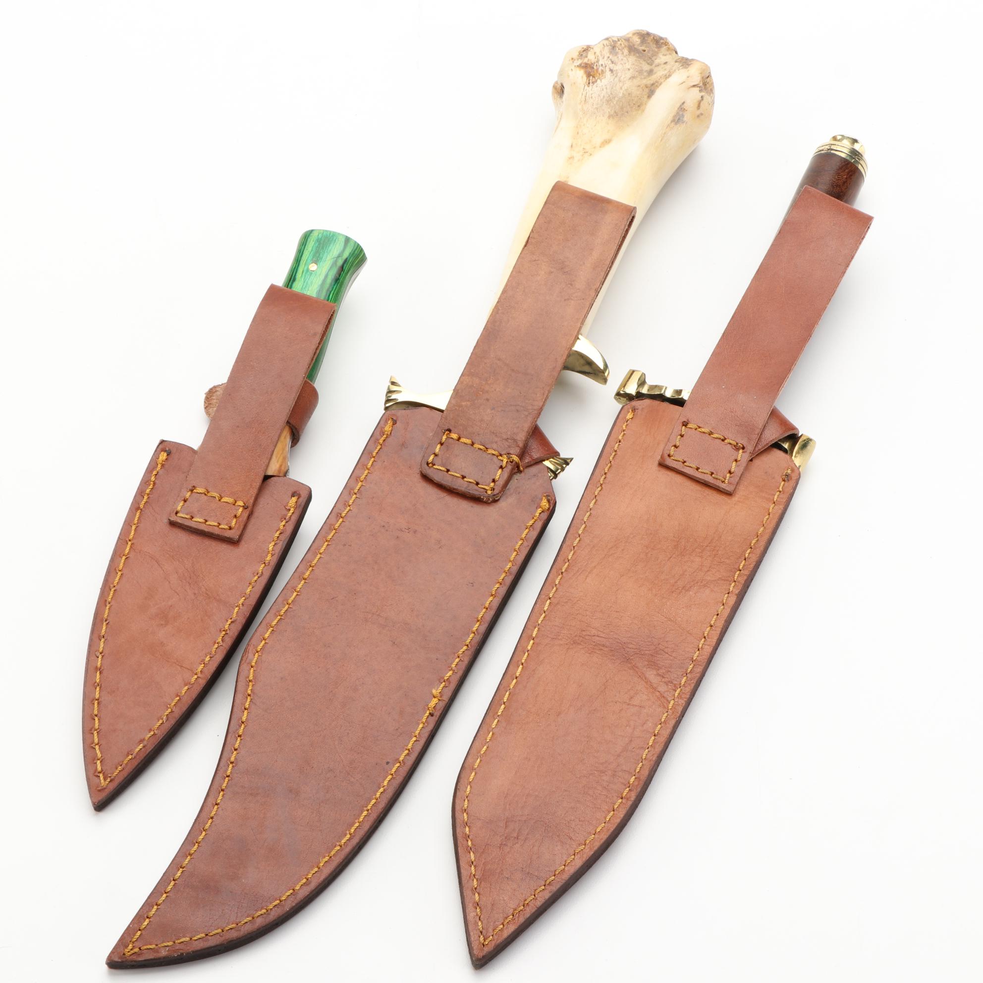 Three Different Damascus Steel, Wood, and Bone Handled Kris Knives and