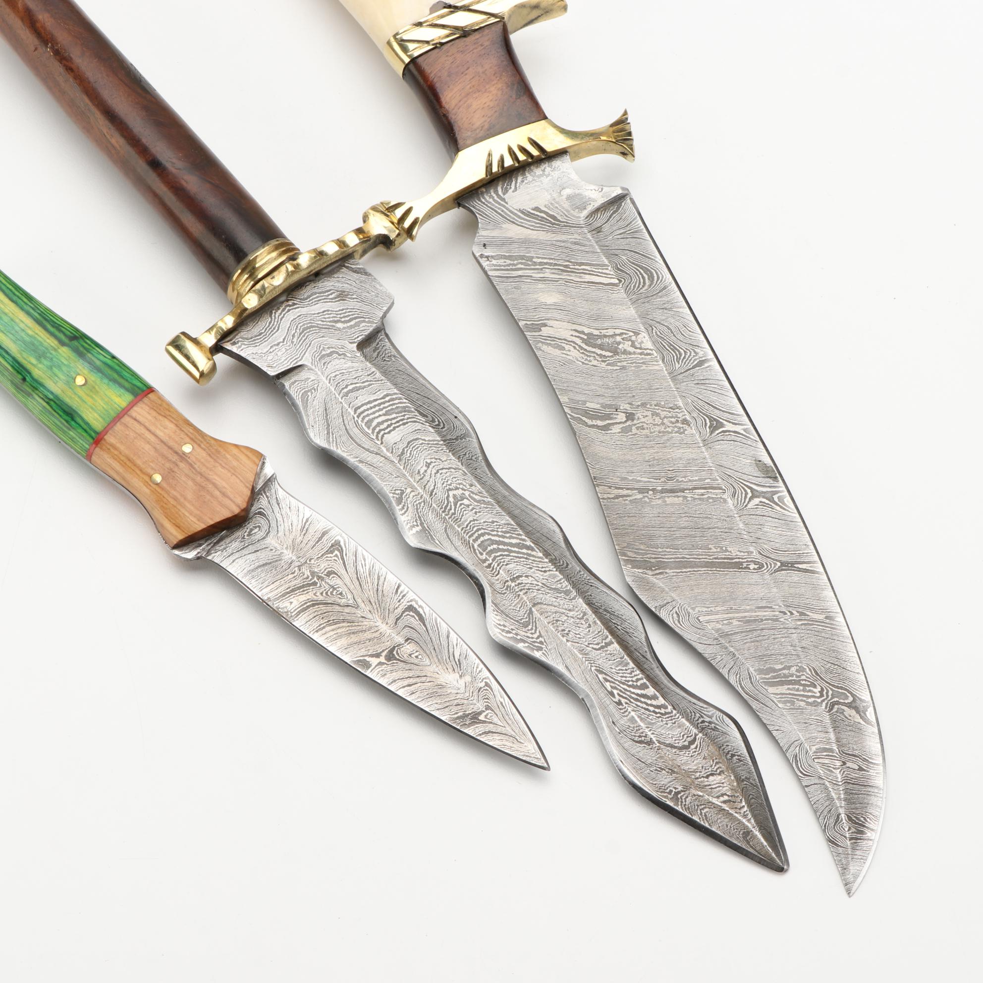 Three Different Damascus Steel, Wood, and Bone Handled Kris Knives and