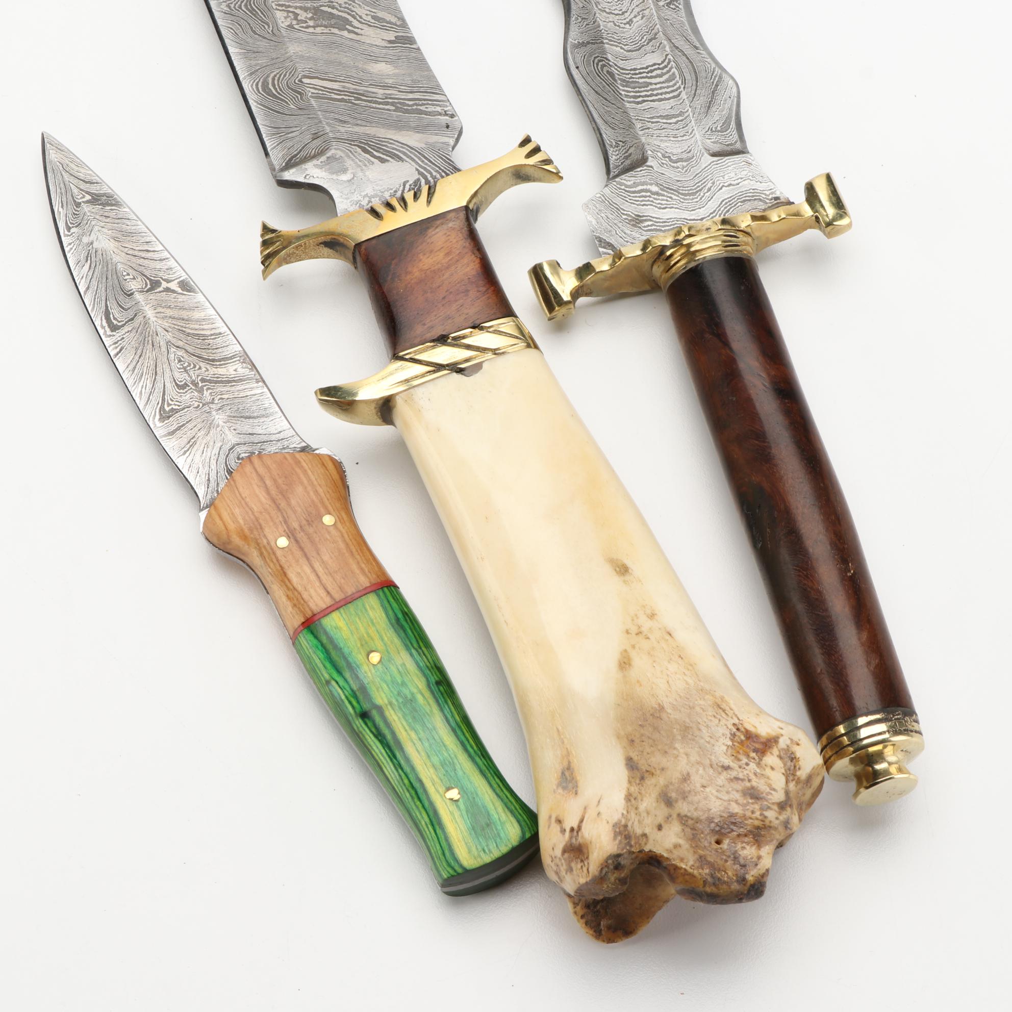 Three Different Damascus Steel, Wood, and Bone Handled Kris Knives and
