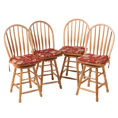 Four American Colonial Style Oak Swivel Windsor Counter Stools