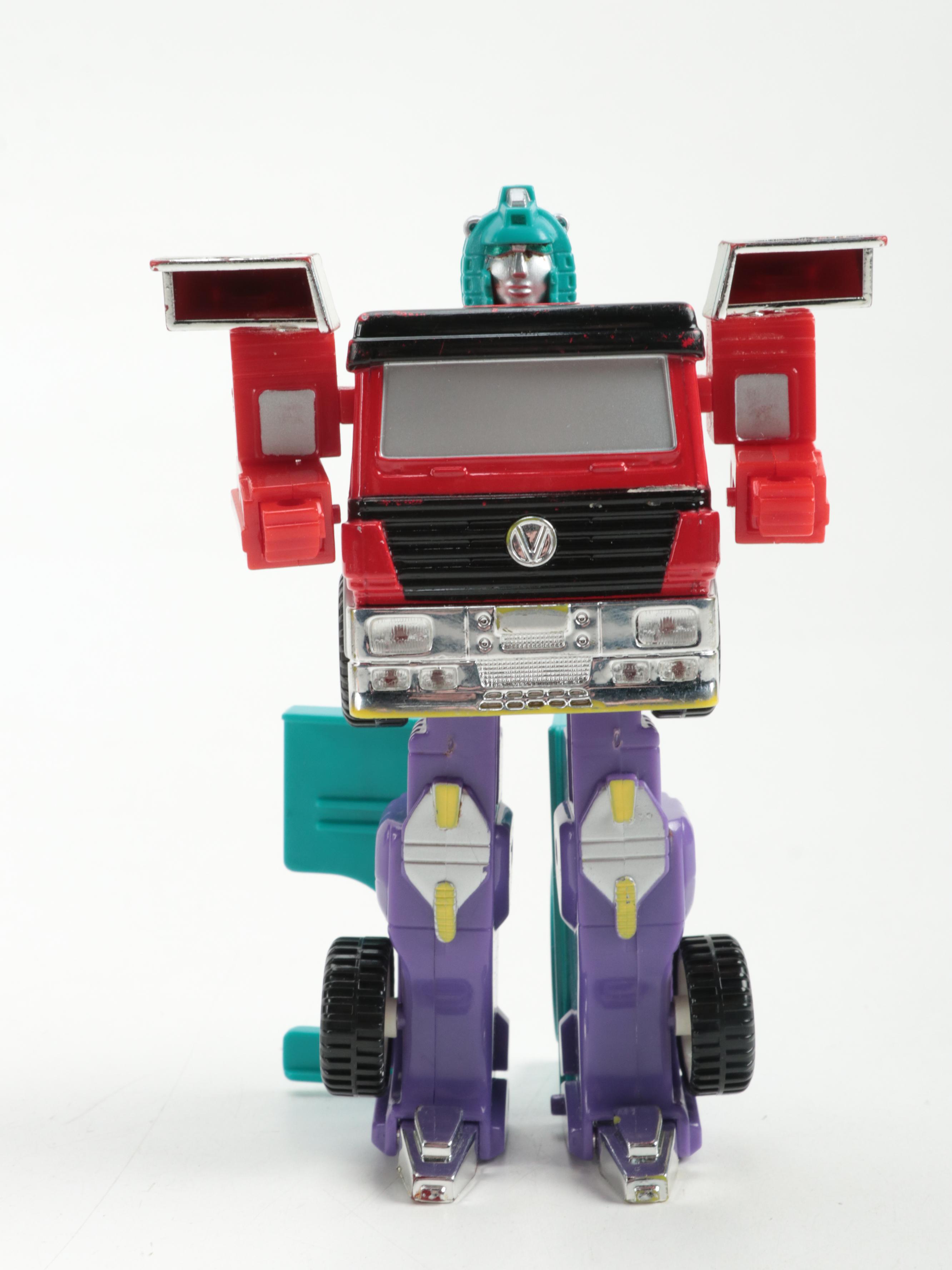 Transformer Action Figure with Other Cars and Race Track | EBTH