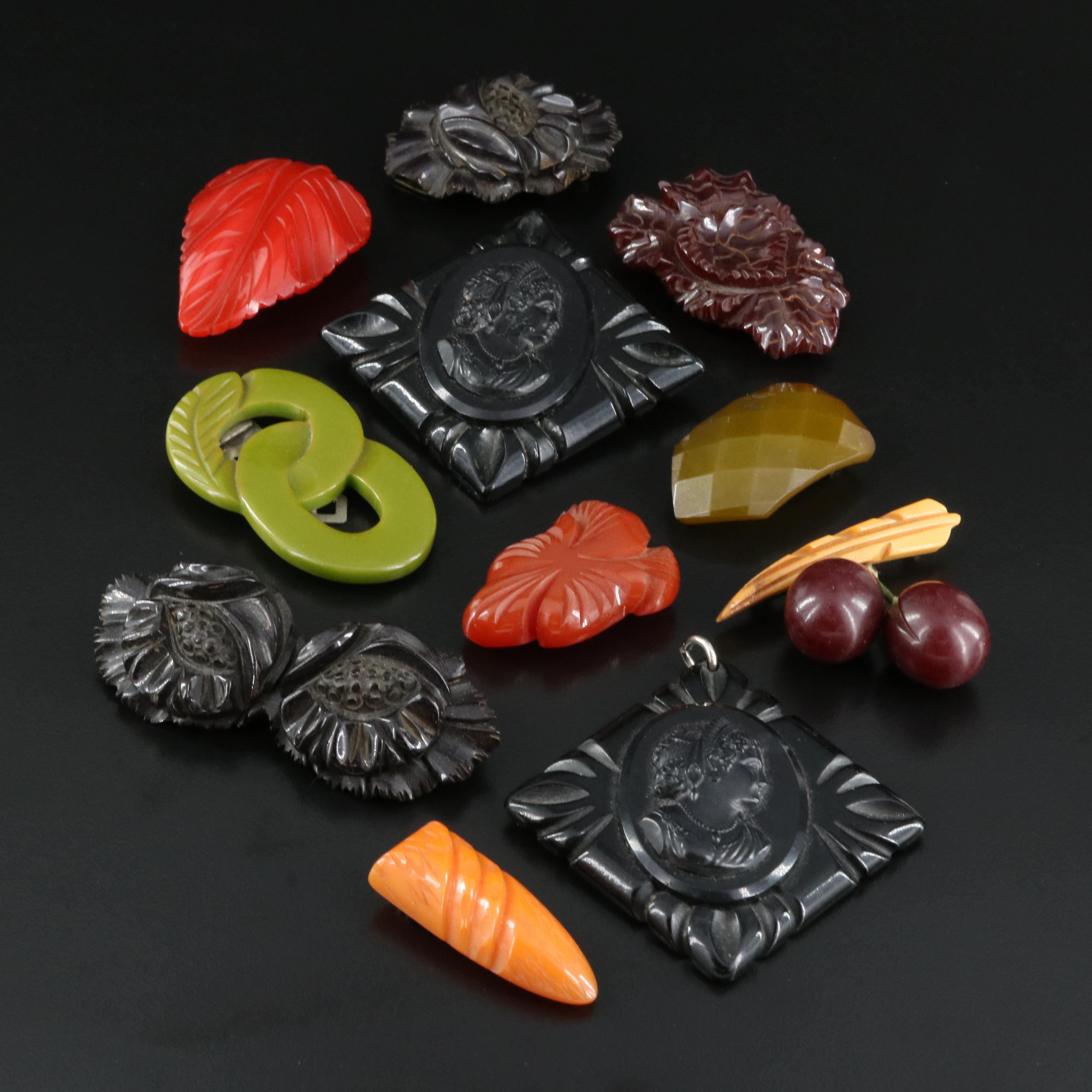 Vintage Carved Bakelite Brooches, Clips and Pendant EBTH
