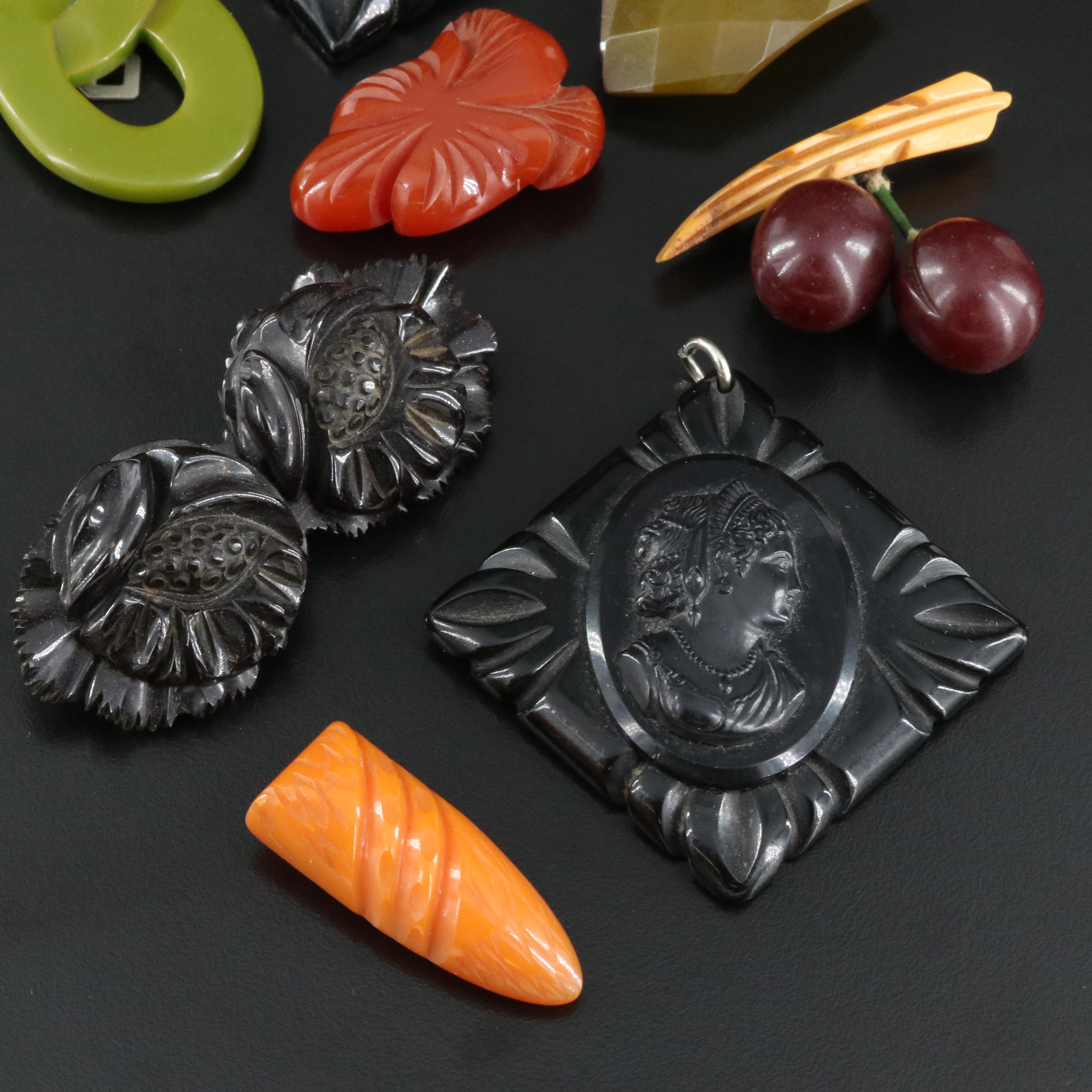 Vintage Carved Bakelite Brooches, Clips and Pendant EBTH