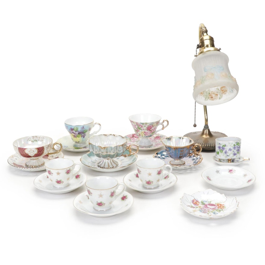Selection of Porcelain Teacups With Saucers and Brass and Glass Reading Lamp
