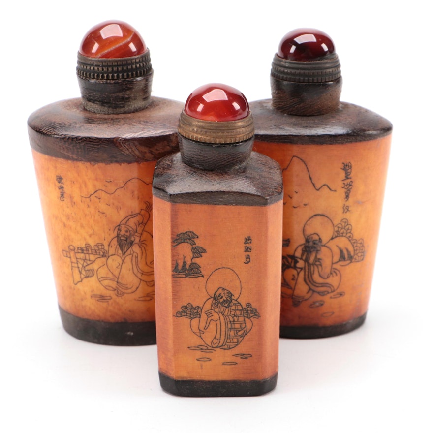 Three Chinese Etched Bone, Wood and Glass Snuff Bottles