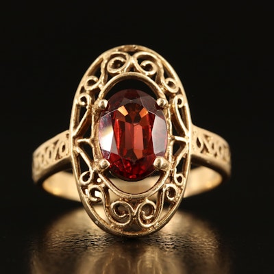 14K Garnet Oval Ring with Scroll Detail