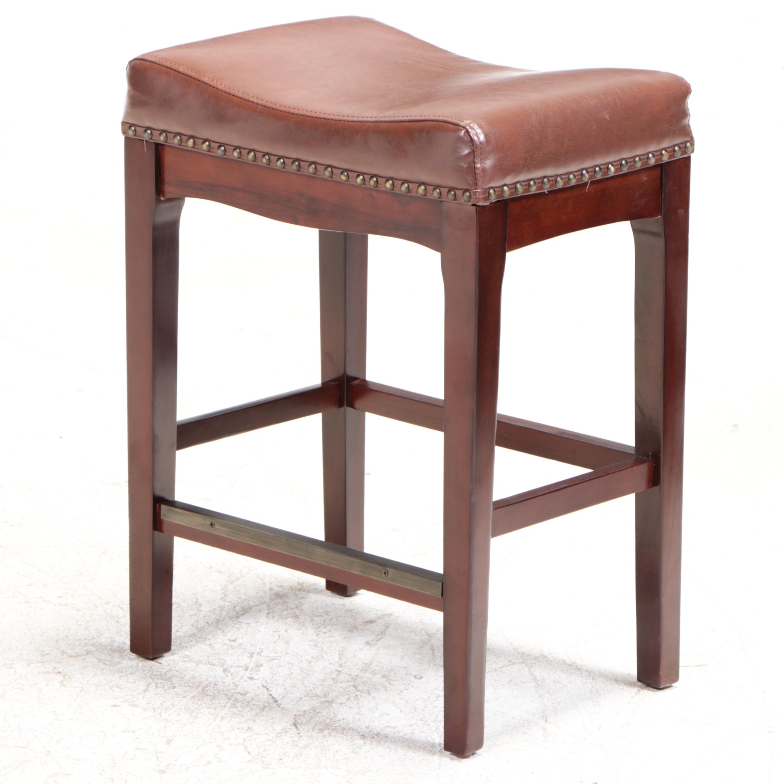 Three Bombay Company MahoganyStained and FauxLeather Counter Stools